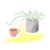 観葉植物とマグカップのコーヒー