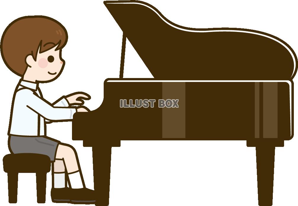 グランドピアノを弾く男の子