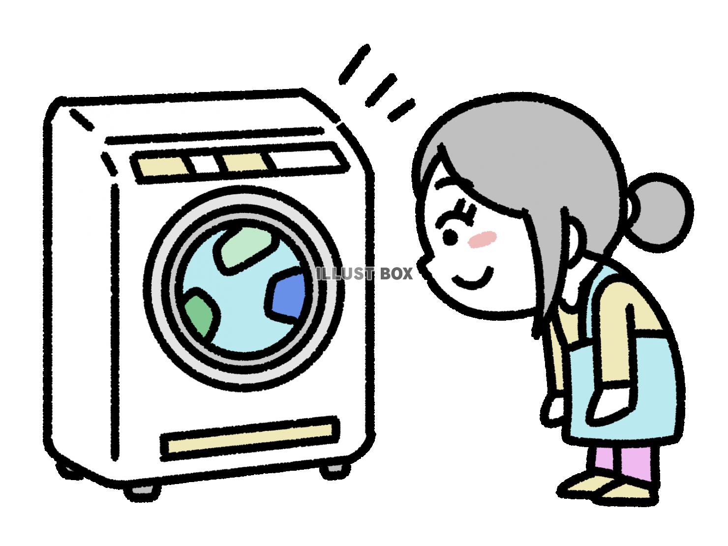 ドラム式洗濯機を覗いている女性