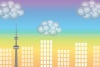 都市の町並みとタワーが夕朝焼けの虹色に染まる風景