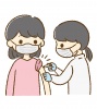 予防接種をする看護師と女性