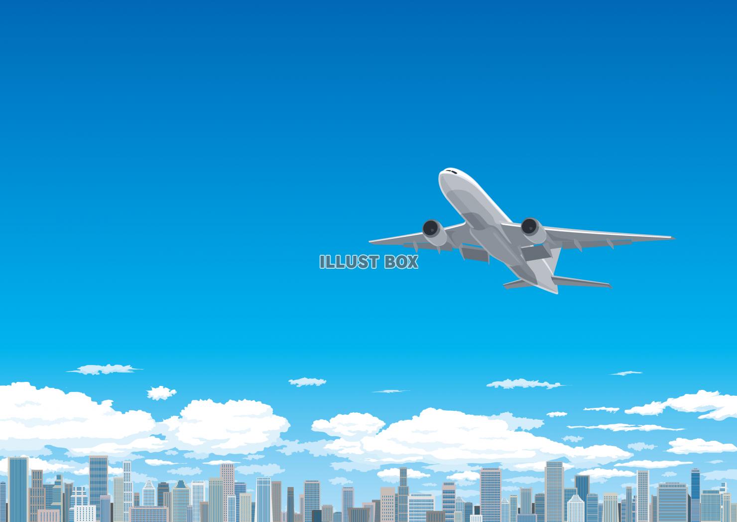 都市の上空　青空を飛行するジェット機