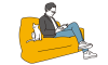 ソファで本を読む男性と白猫
