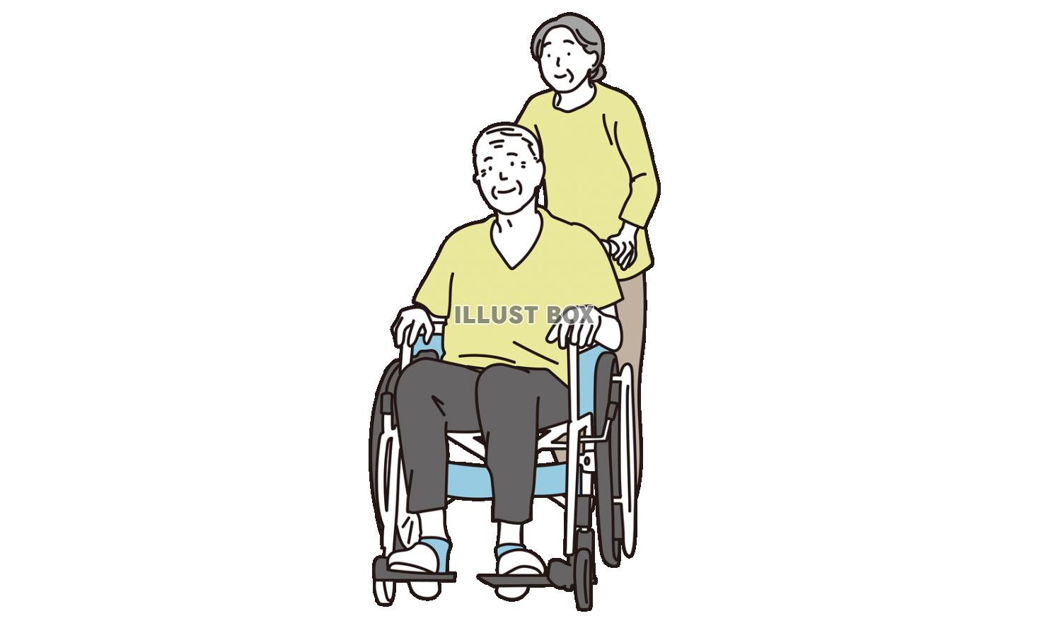 車椅子に乗る高齢者と介護する女性