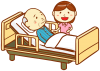 高齢男性と介護士と介護用ベッド