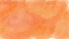 オレンジ色のにじんだ水彩タッチの抽象背景