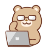 めがねの熊とパソコンのイラスト