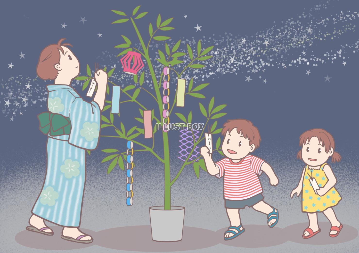 七夕飾りに短冊をつける女性と子供たち