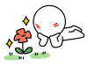 うつ伏せになって花を眺める棒人間