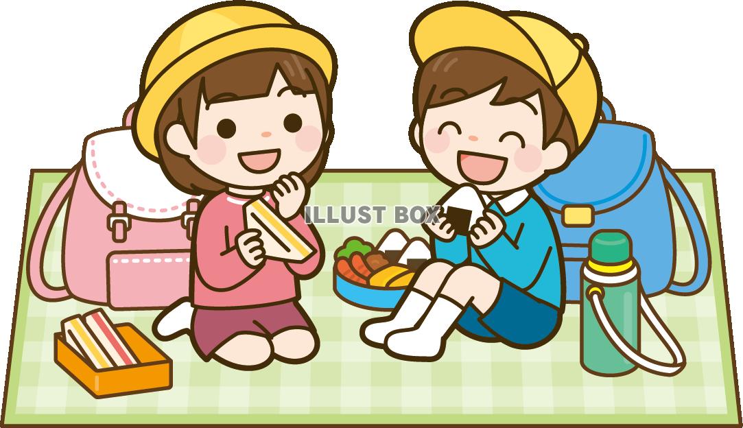 遠足でお弁当を食べる小学生